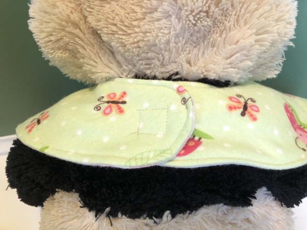 Baby Bib Showing back of bib on Stuffed animal