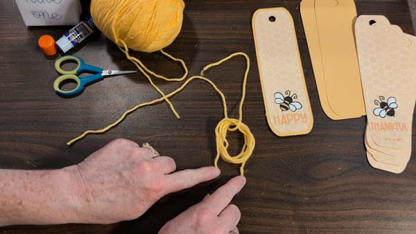 Bee Bookmarks Tassel 6 Place Yarn through loop