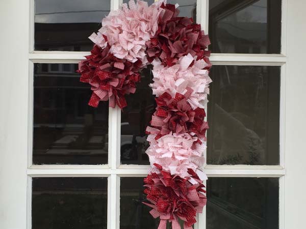 Candy Cane Rag Wreath Hanging On Door