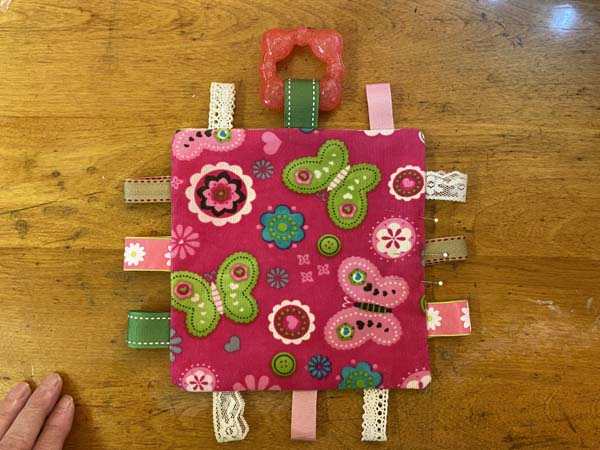 Crinkle Tag Toy Pinned Opening
