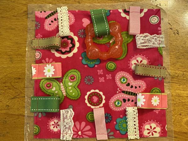 Crinkle Tag Toy Place On Top Of Crinkle Paper