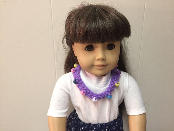Doll Crocheted Beaded Necklace Tutorial - Closeup On Doll