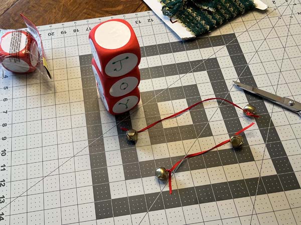 Cube Ornament 6 Bells Tied To Ribbon