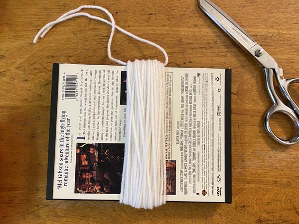 DIY Yarn Ghost Garland Thread Through Tie Yarn