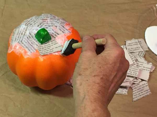 Decoupage Book Pumpkin - Apply Mod Podge and Paper