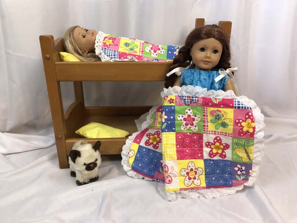 Doll Bed Quilt Doll Holding Quilt and Doll In Bed Under Quilt