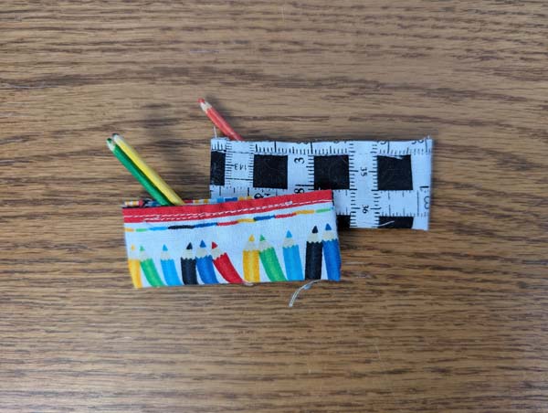 Doll Pencil Case Closeup Two Pencil Cases with 3 pencils