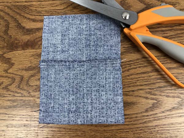 Double Stitch Seam 8 Seam Ironed showing with shears