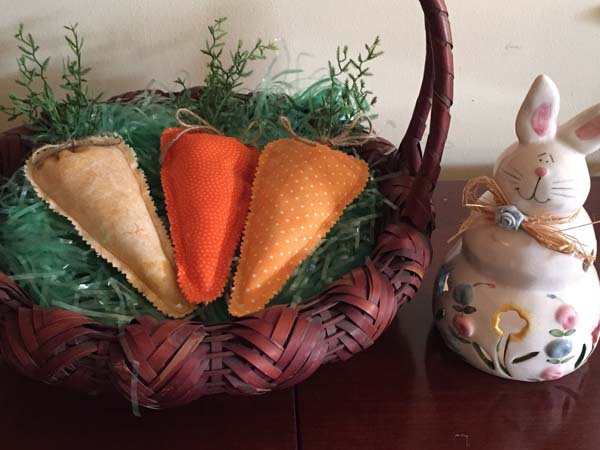 Fabric Carrot In Basket with ceramic bunny closeup