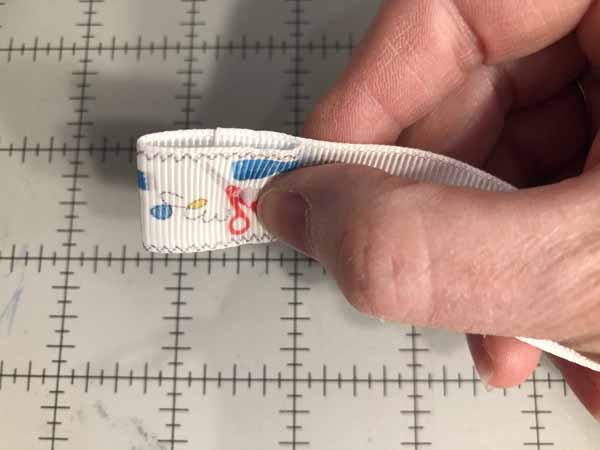 Face Mask Strap Lanyard Tutorial - Place Cap through Ribbon Back Side