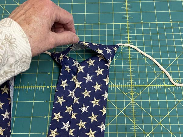 Flag Garland Place ends through loop