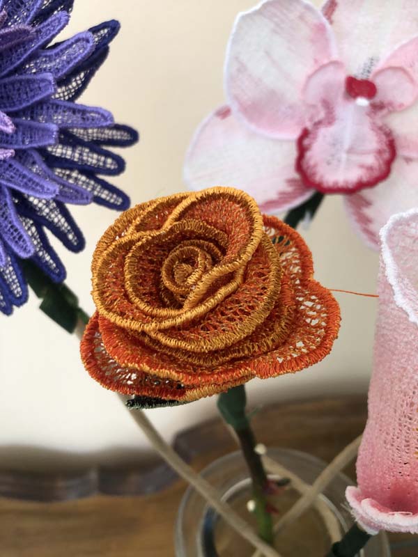 Freestanding Lace Flowers Orange Rose Closeup