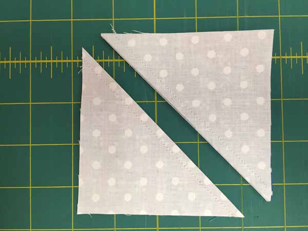 I Spy Quilt Half Square Triangles Cut.JPG