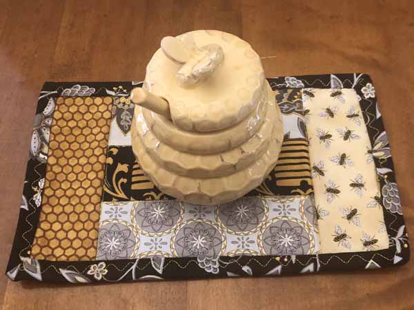 Free Jelly Roll Mug Rug Pattern Finished with Honey Jug