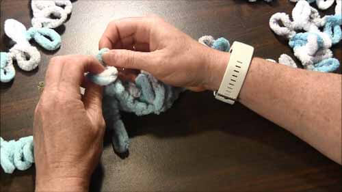 Loop Yarn Loopy Stitch Tutorial - Insert foundation through two loops