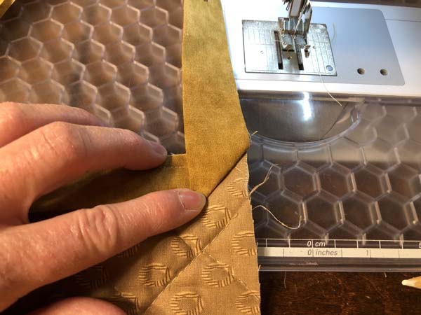 Mitered Corner 8 Fold Binding at 45 degree angle.