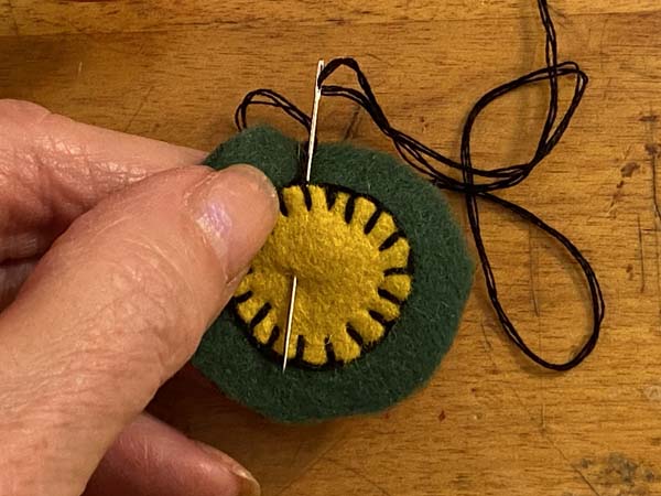 Penny Rug Ornament 18 Hide knot