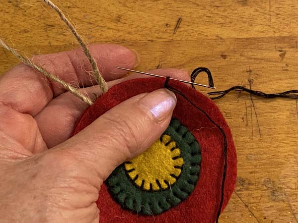 Penny Rug Ornament 28 Under first stitch