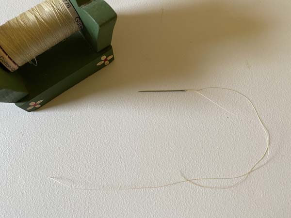 Quilters Knot Threaded Needle