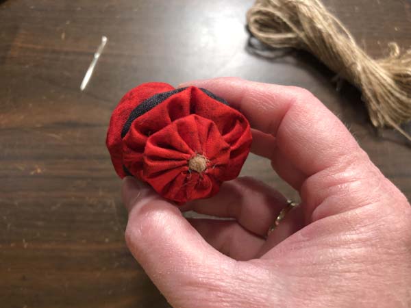 Santa yo yo ornament Showing knot at bottom