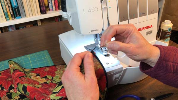 Sew a Napkin Pull tail to knot