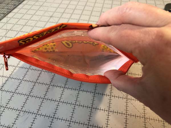 Snack Wrapper Pouch Pleated Bottom Inside Bag showing pleat