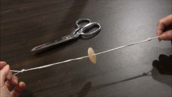 Spinning Button Toy - How to Hold