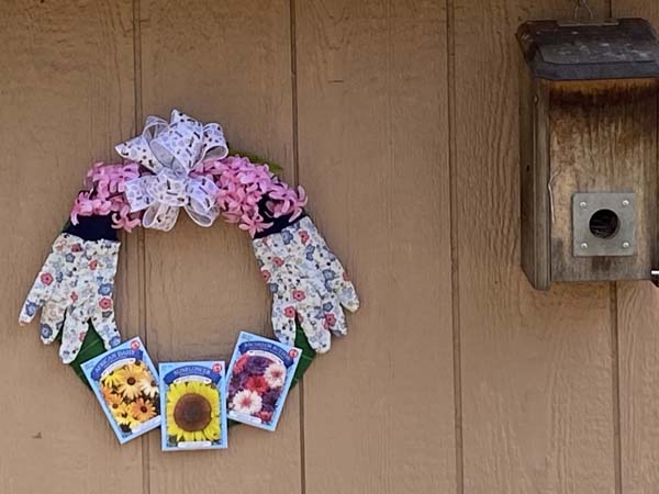 Spring Wreath On Shed with Birdhouse