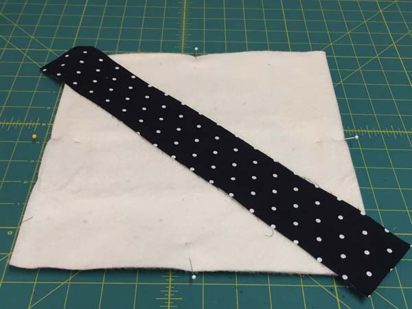 String Pieced Potholder Add Strip Across Diagonal