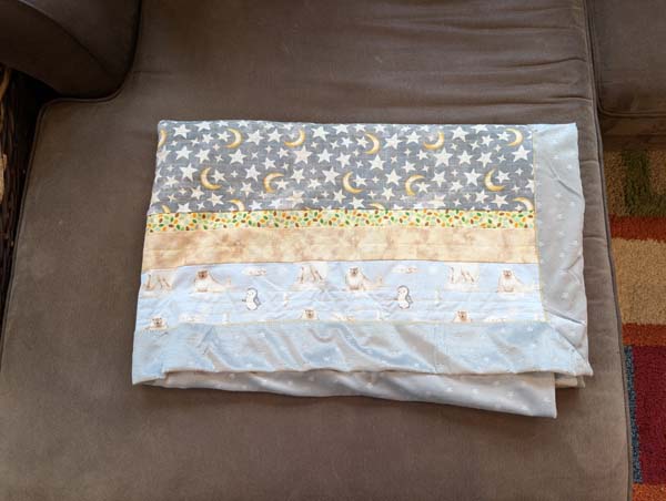 Strip Quilt with Animal print folded