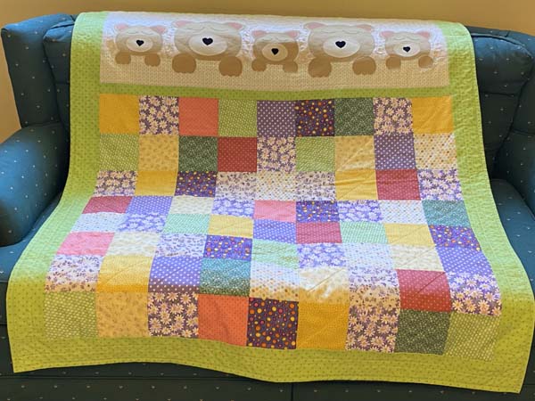 Sweet Dreams Baby Quilt on Couch