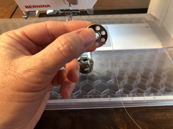 Thread a Bobbin 14 Hold Bobbin Figure 9