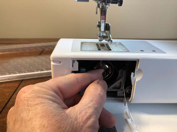 Thread a Bobbin 21 Keep Holding Handle til its in place