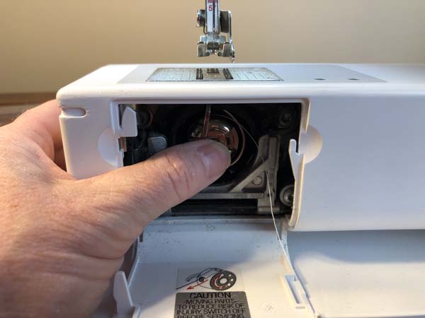 Thread a Bobbin 22 push in til click