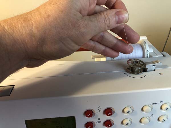 Thread a Bobbin 26 Hold Thread Tail