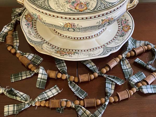 Wood Thread Spool and Wood Bead Garland Finished on Table with Bowl
