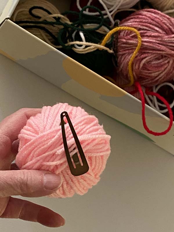 Yarn Unraveling 4 Hair Clip through yarn tail